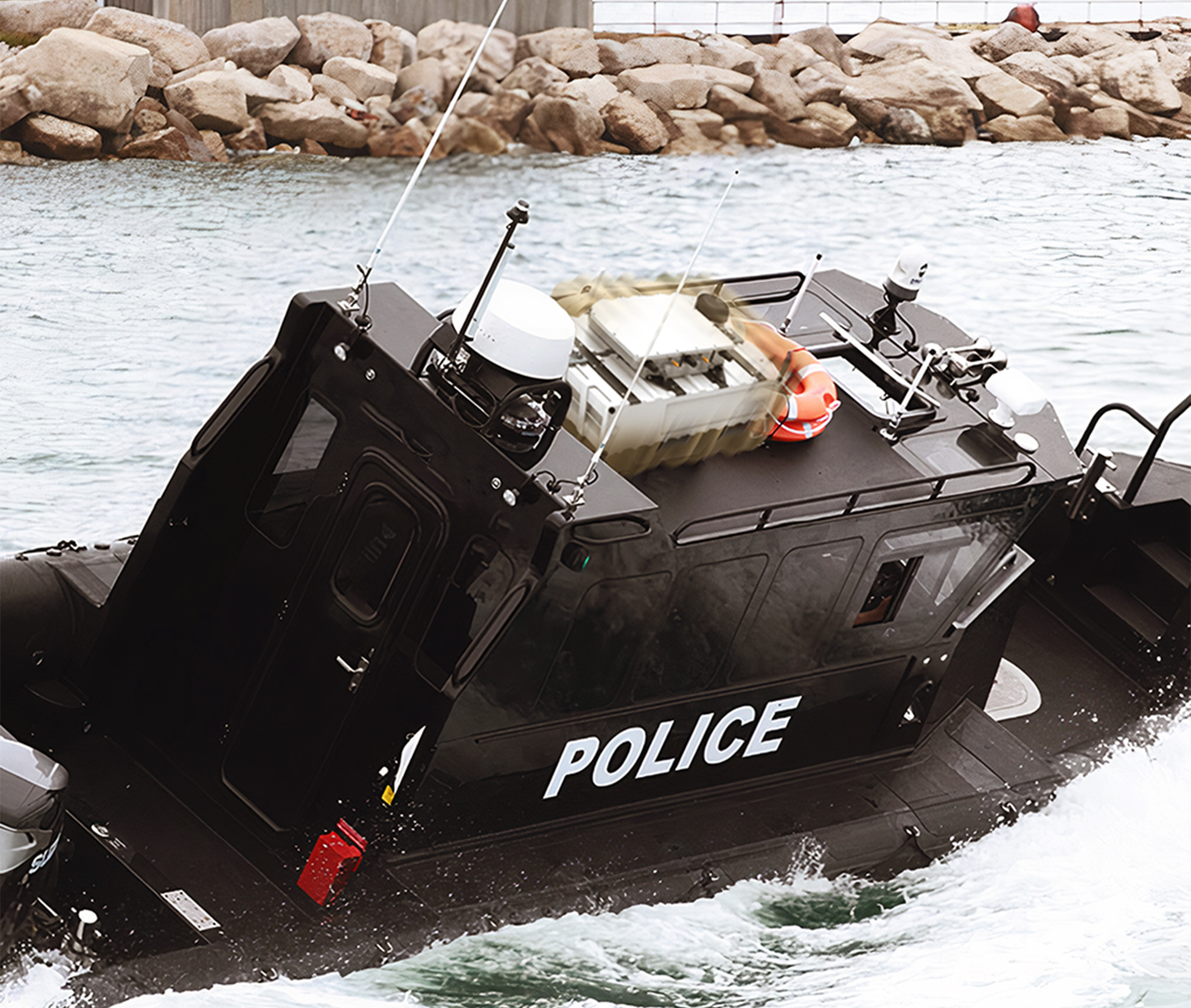 FlexSpec X8400 System case mounted on top of a tactical police boat near a harbour