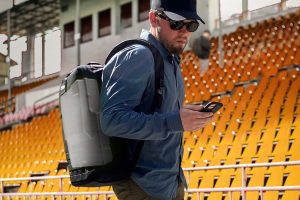 Operator using the FlexSpec Backpack System in a stadium setting looking for radiation
