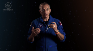 Canadian Astronaut holding a BTI bubble detector